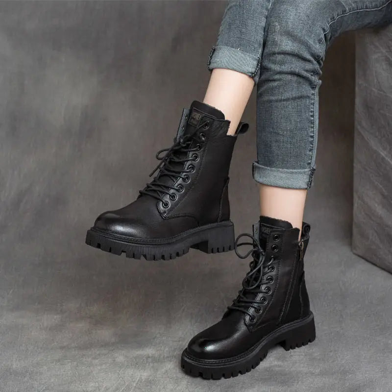Black leather Martin Boots women’s chunky lace up combat boots featuring a side zipper and thick sole.