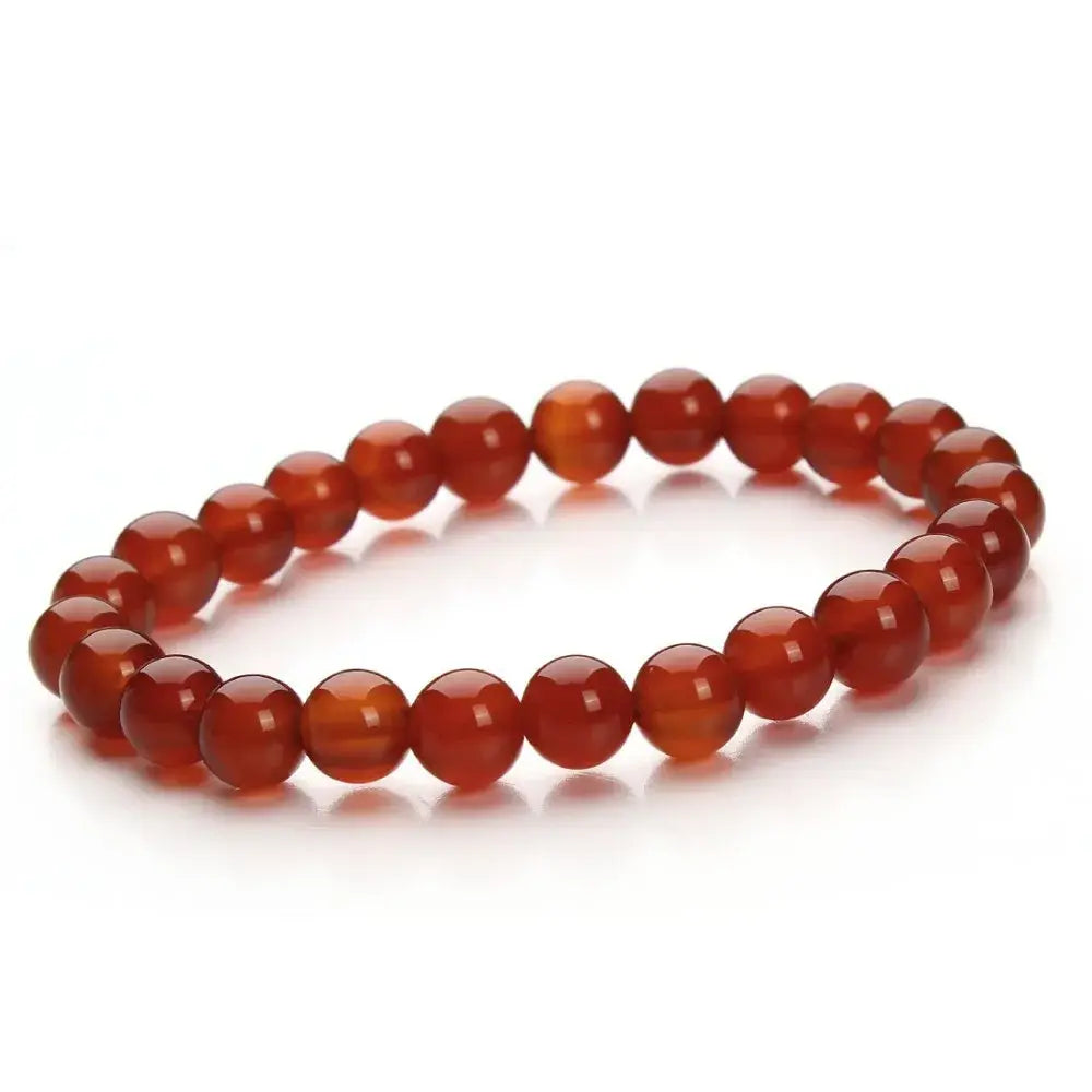 Natural polished gemstone and agate beaded bracelet with smooth translucent reddish-orange agate beads and a polished finish.