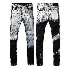 Men’s distressed slim fit patchwork denim jeans in black and white tie-dye with slim fit and distressed details along the legs.