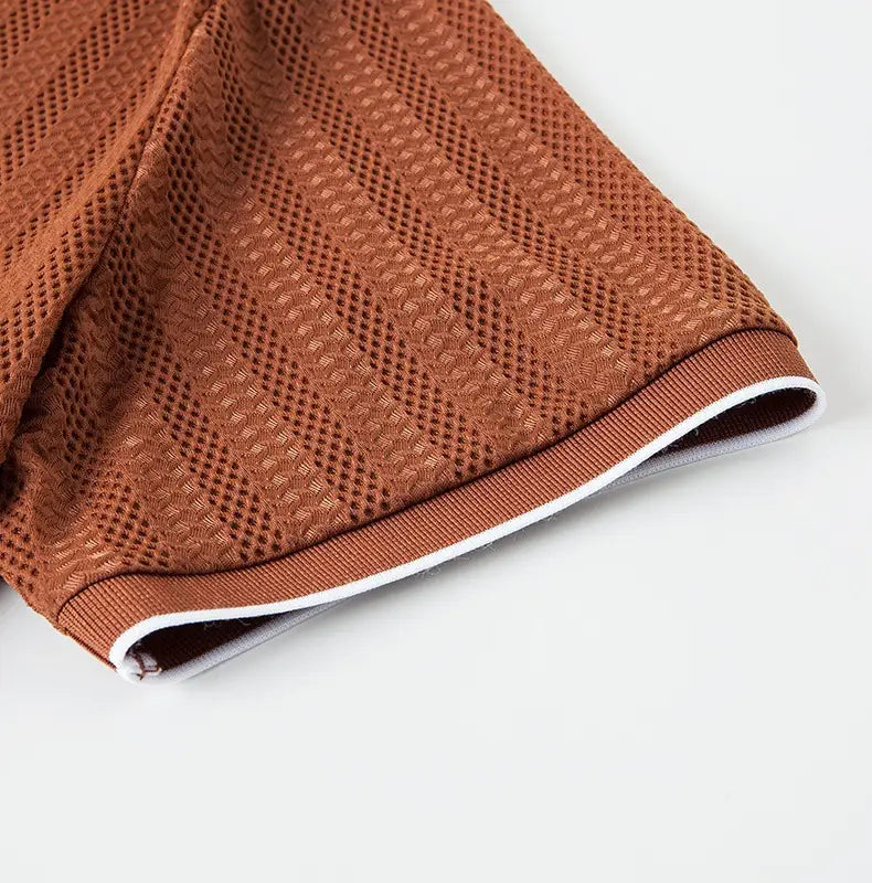 Men’s textured ice silk contrast trim polo shirt featuring brown mesh fabric with ribbed trim and white inner lining.