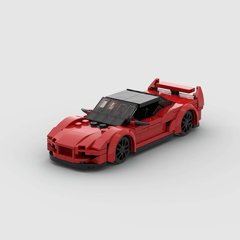 Roter Lego-Technic-Sportwagen-Baukasten als Spielzeug, mit einem schlanken, aerodynamischen Design mit schwarzen Rädern.