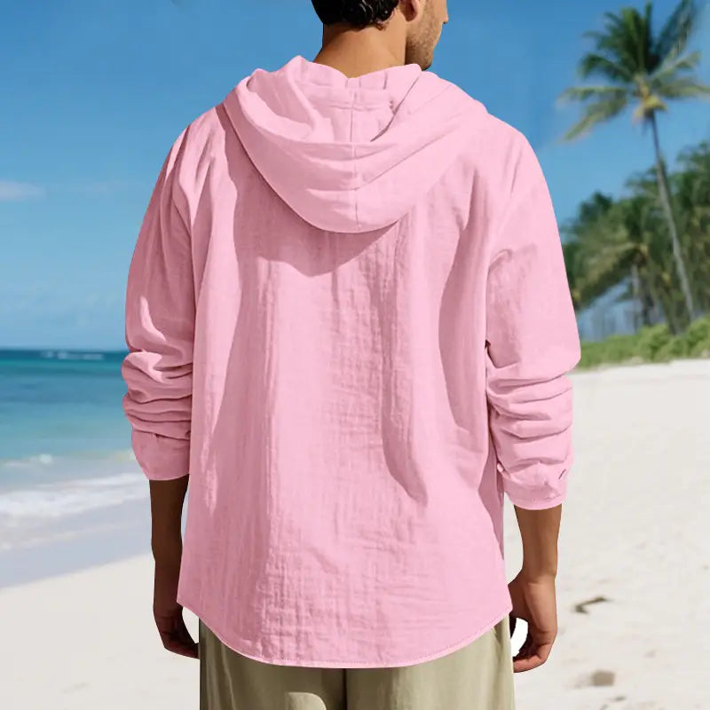 A soft pink men linen hooded cardigan shirt with long sleeves made of lightweight fabric.