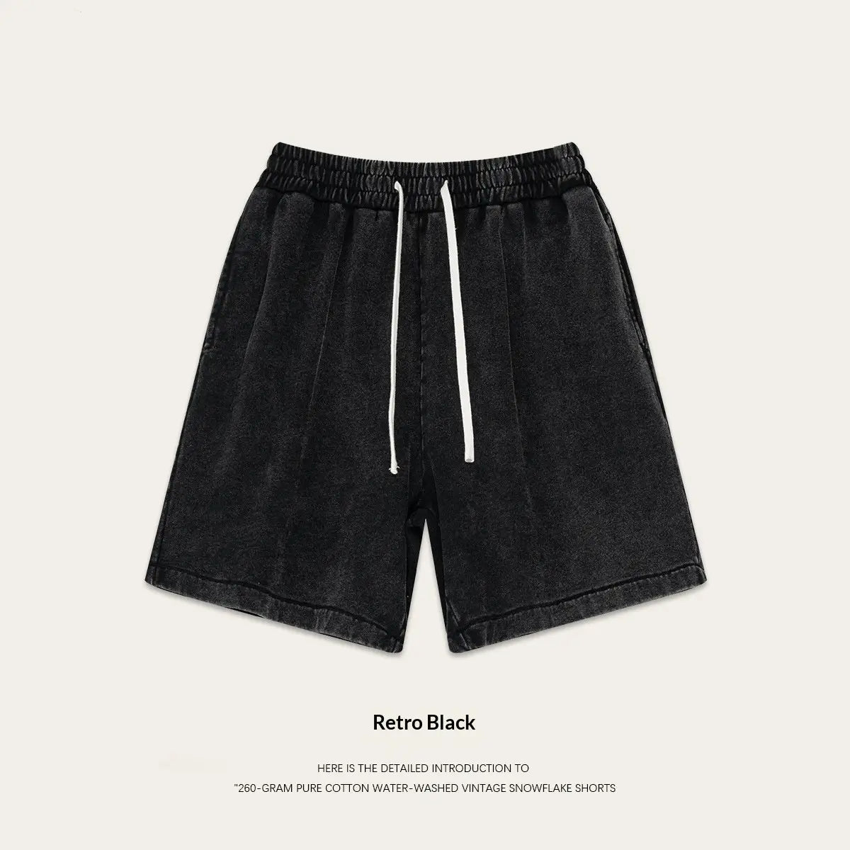 Mens distressed cotton shorts black water-washed vintage snowflake pattern made of 260 gram pure cotton with a relaxed fit elastic waistband and white drawstrings suitable for summer apparel.