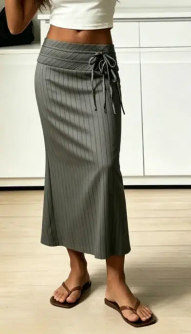 Gray pinstripe mermaid midi skirt with tied waistband detail in a formal fabric.