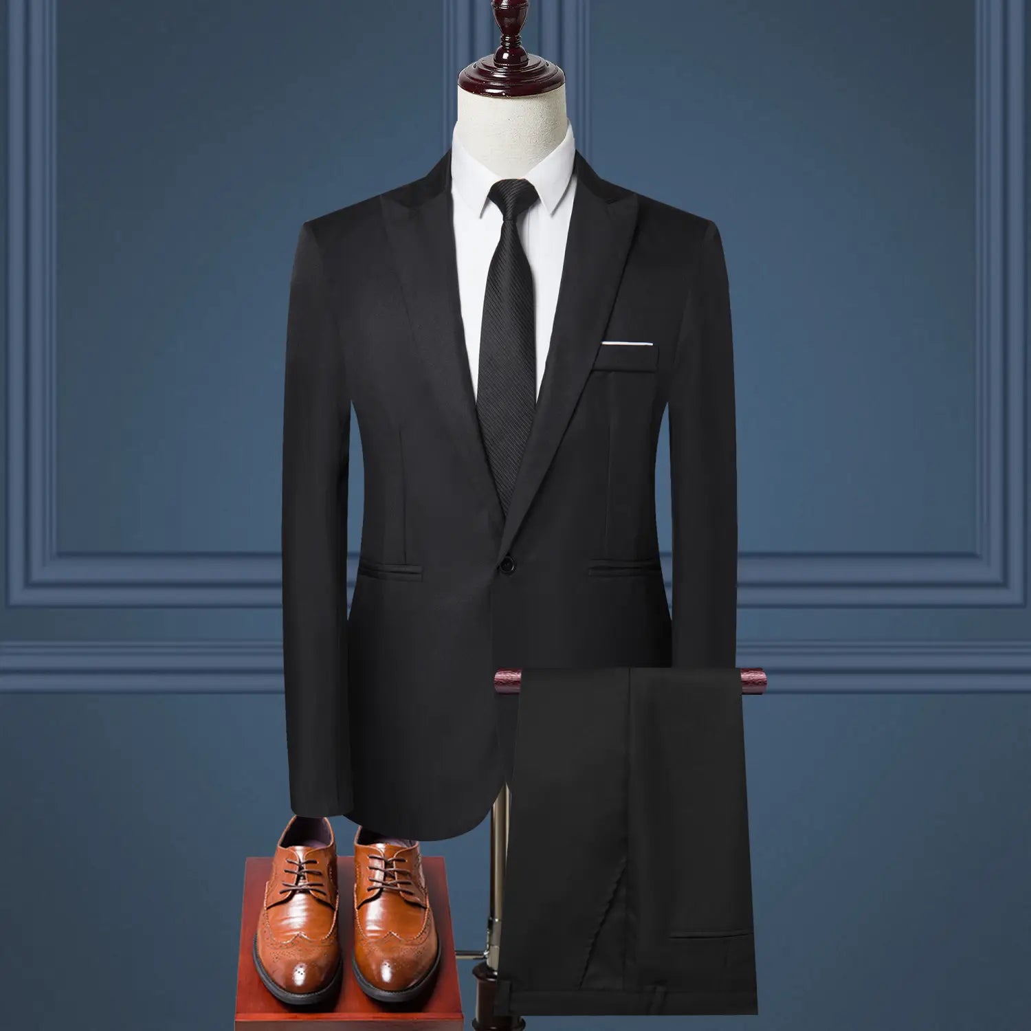 Black tailored men solid color two piece leisure suit featuring a single-breasted jacket with notched lapels and matching trousers.