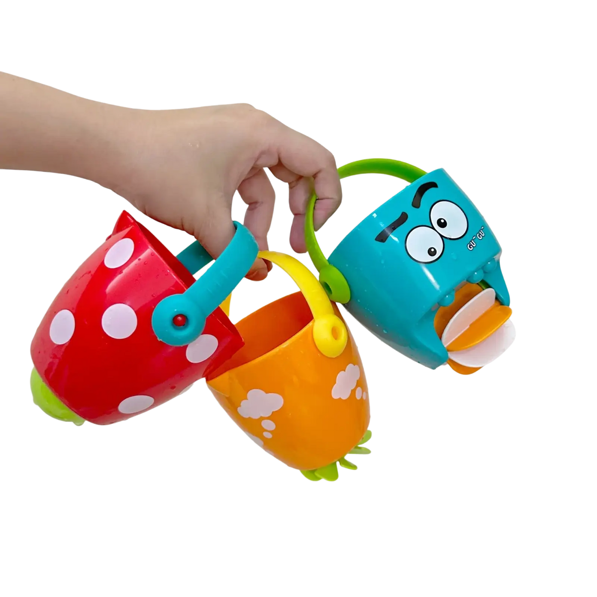 A hand holds three colorful plastic baby bath buckets with playful designs for water spraying toy set use