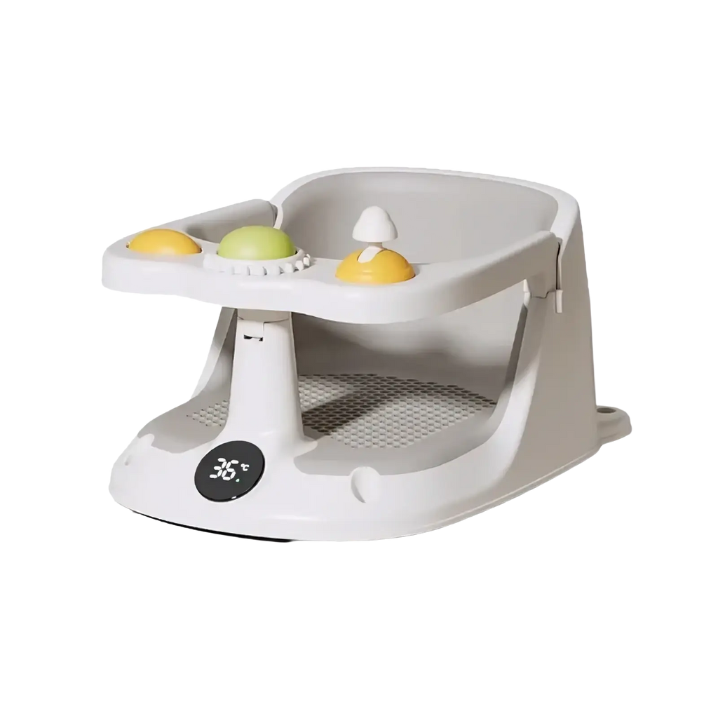 Gray plastic baby bath seat with temperature display and suction cups featuring yellow and green textured toys on tray