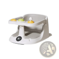 Gray plastic baby bath seat with temperature display and suction cups featuring yellow and green textured toys on tray