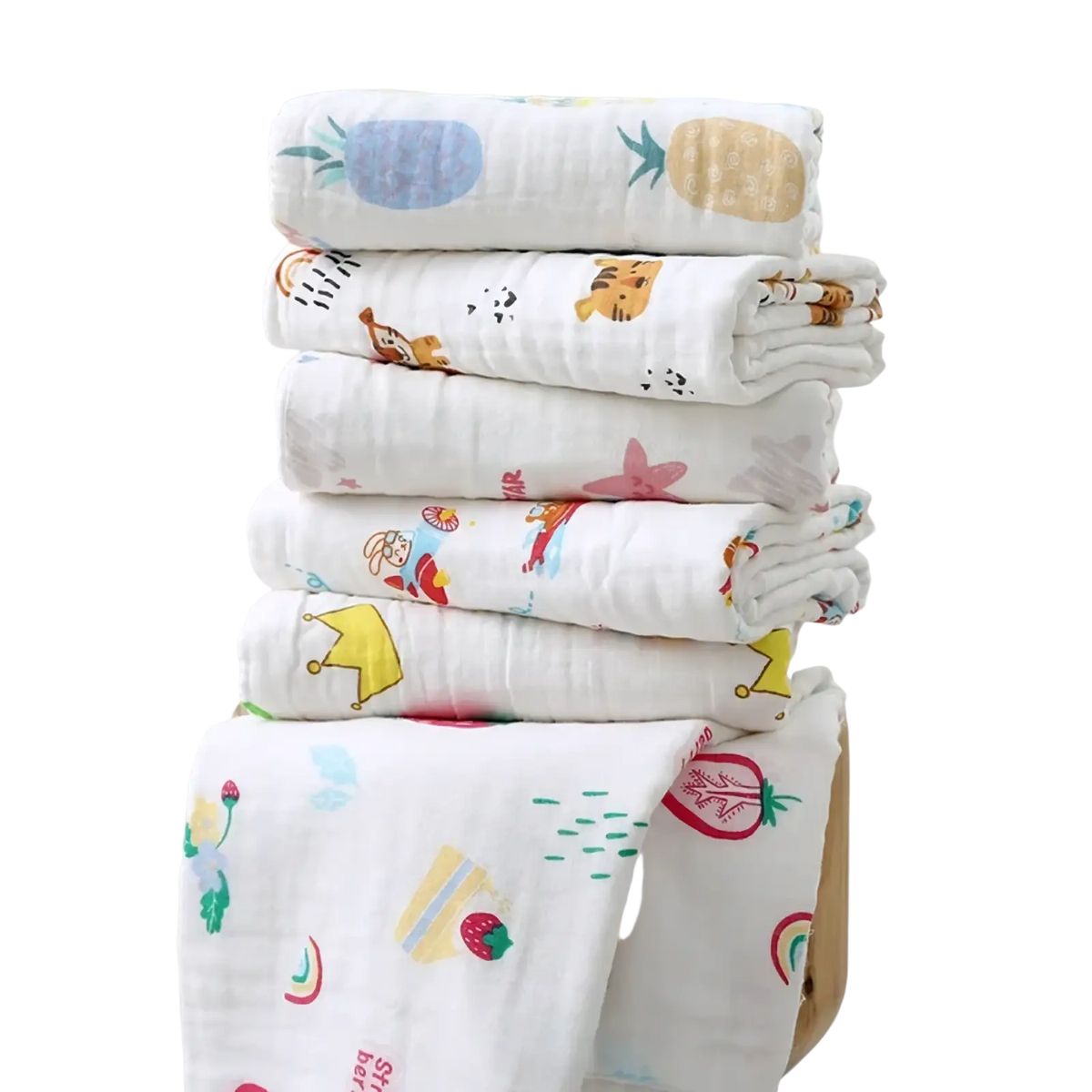 Stack of white pure cotton muslin baby bath towels with colorful cartoon prints for swaddling and bathing