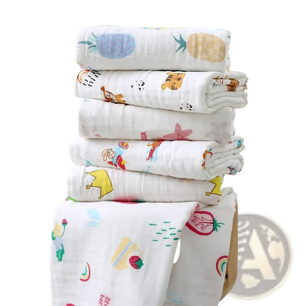 Stack of white pure cotton muslin baby bath towels with colorful cartoon prints for swaddling and bathing