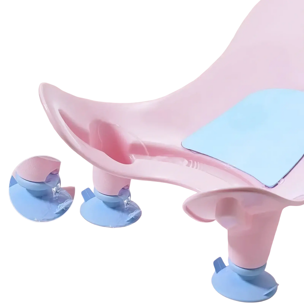 Pink and light blue plastic baby butt washing basin with suction cup feet for infant bath support