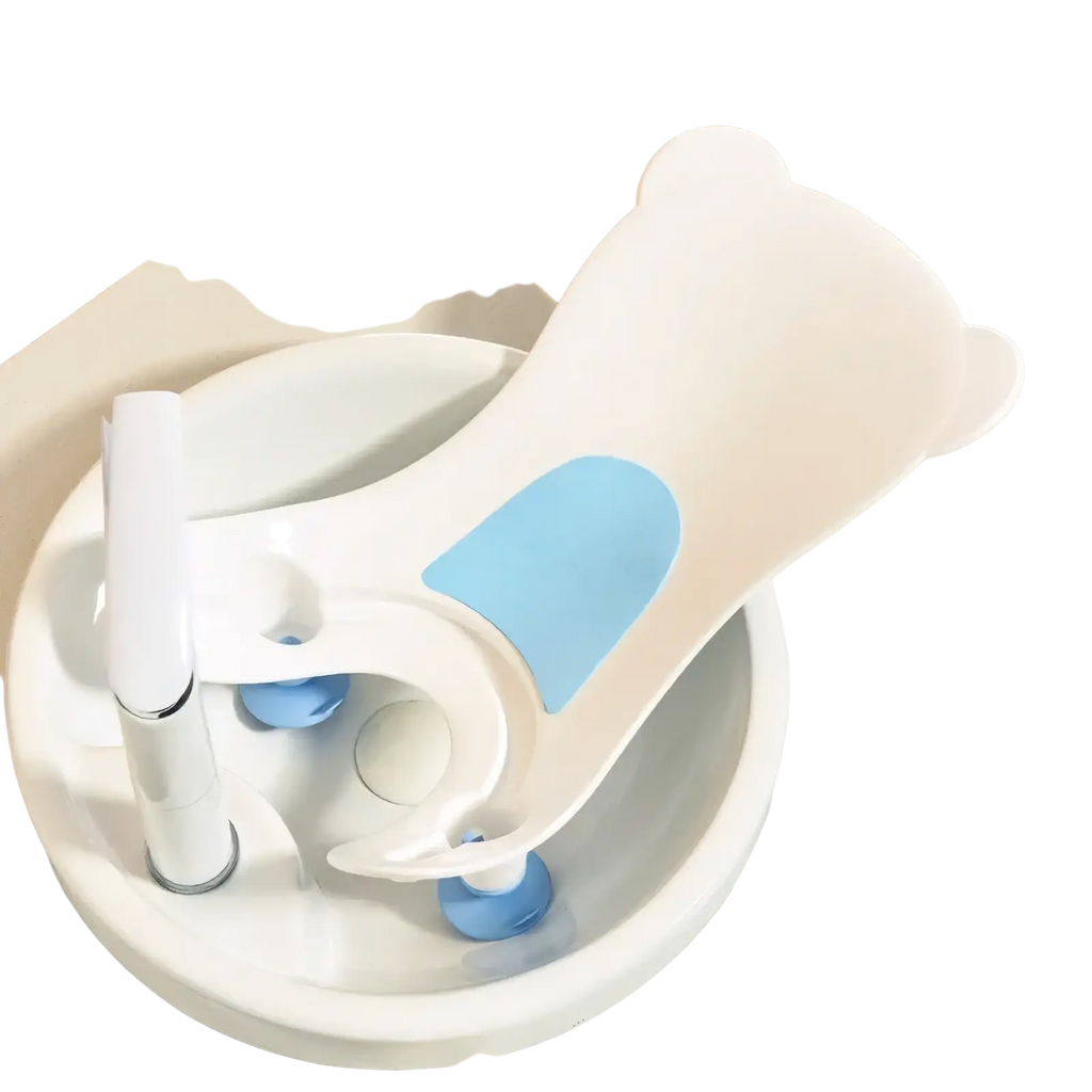 White bear-shaped baby buttocks washing tub with light blue accents and suction cup attachments for bath safety