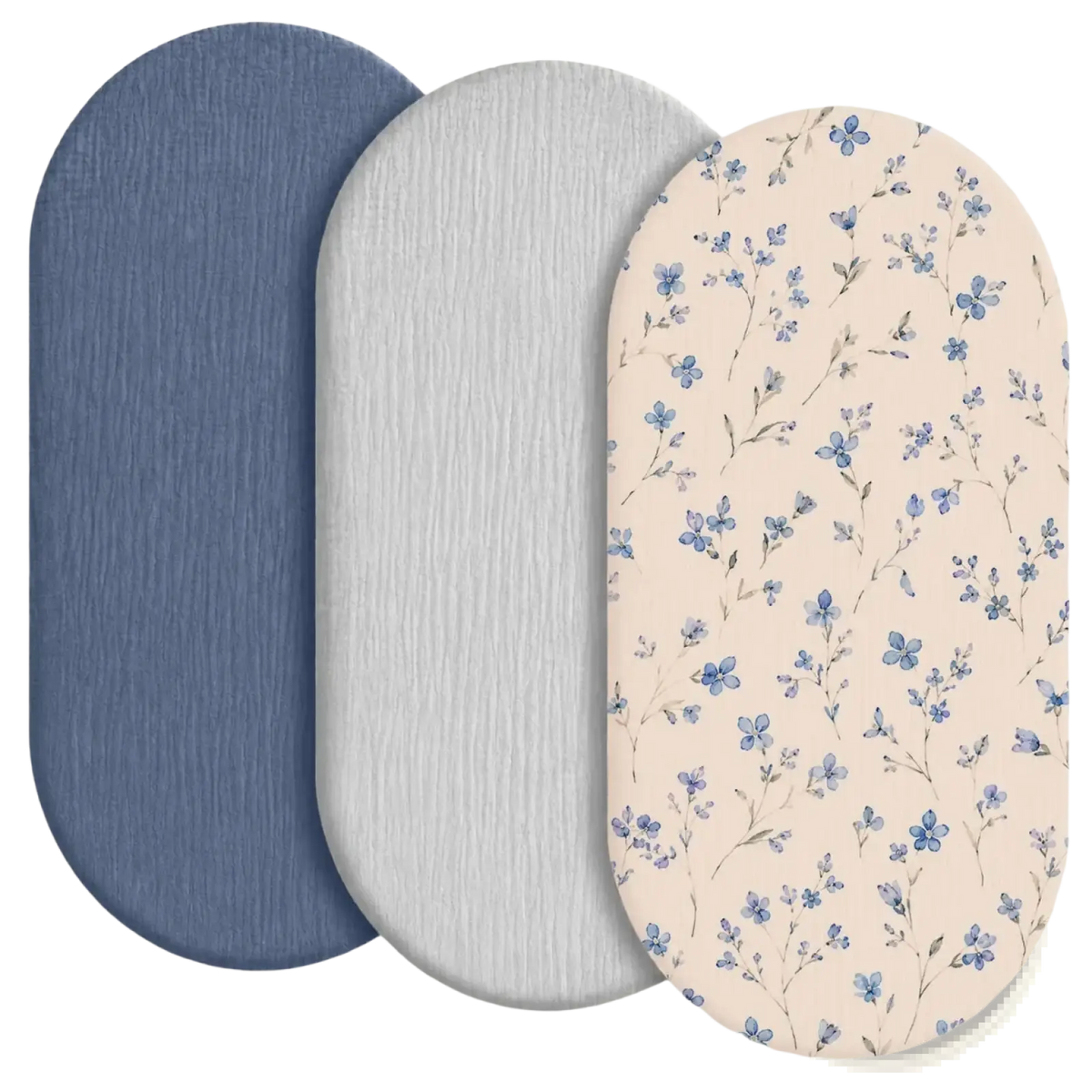 Three oval-shaped bath mats in navy blue light gray and beige with blue floral patterns for bathroom use