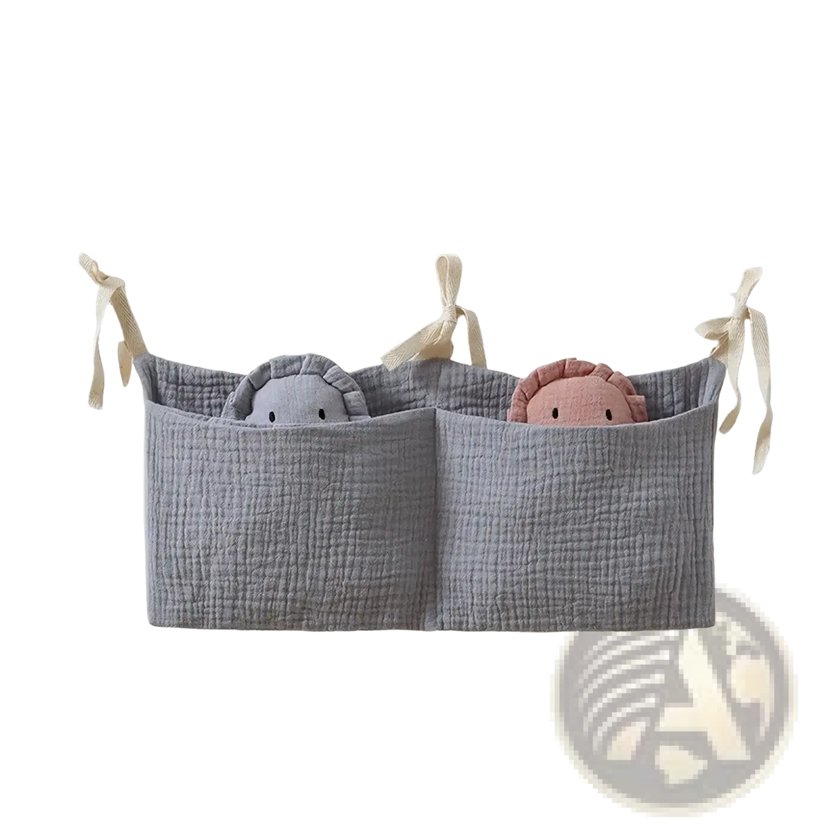 Gray cotton baby crib storage bag with two compartments holding plush toys for bedside organization