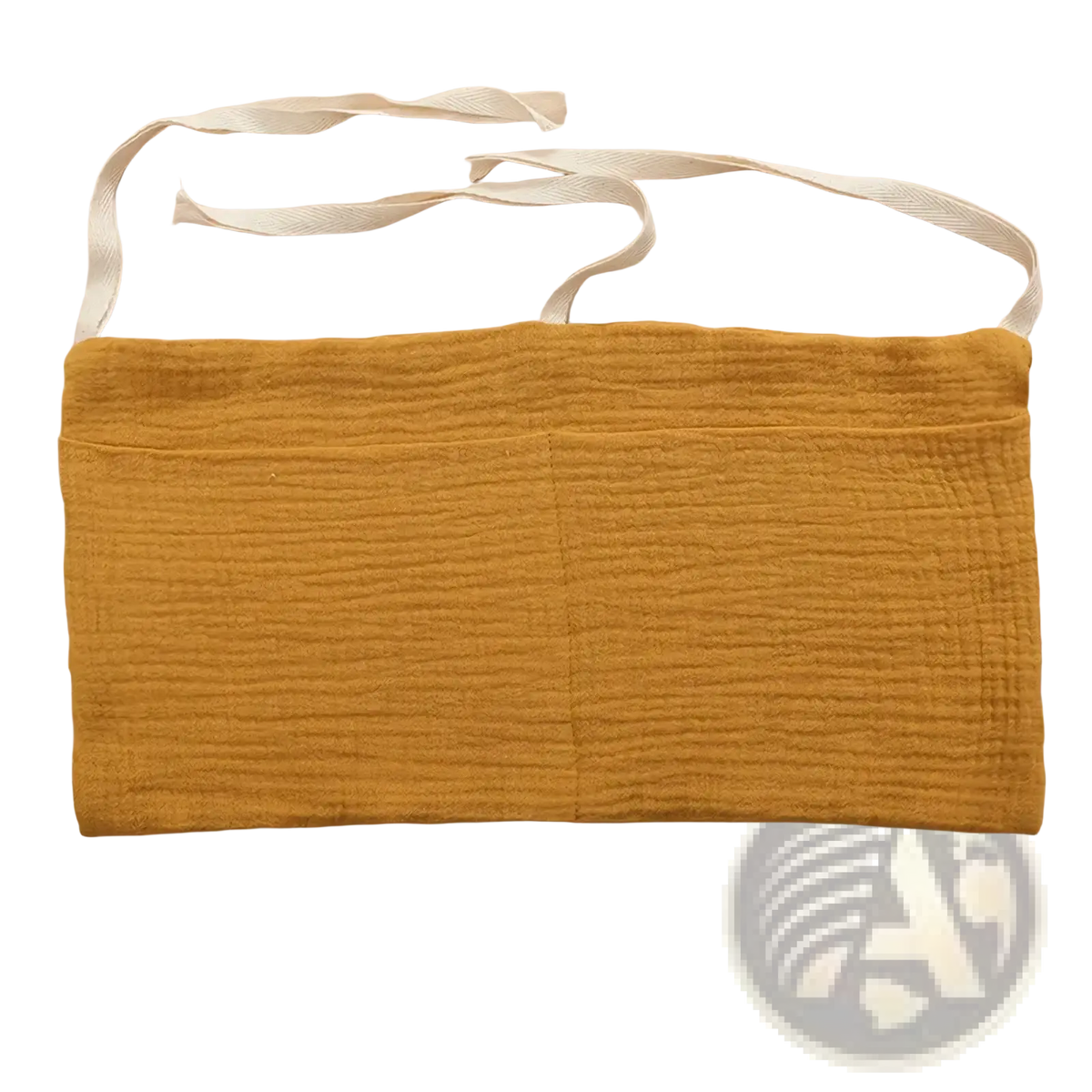 A mustard-yellow textured cotton baby crib storage bag with white fabric ties for bedside organization