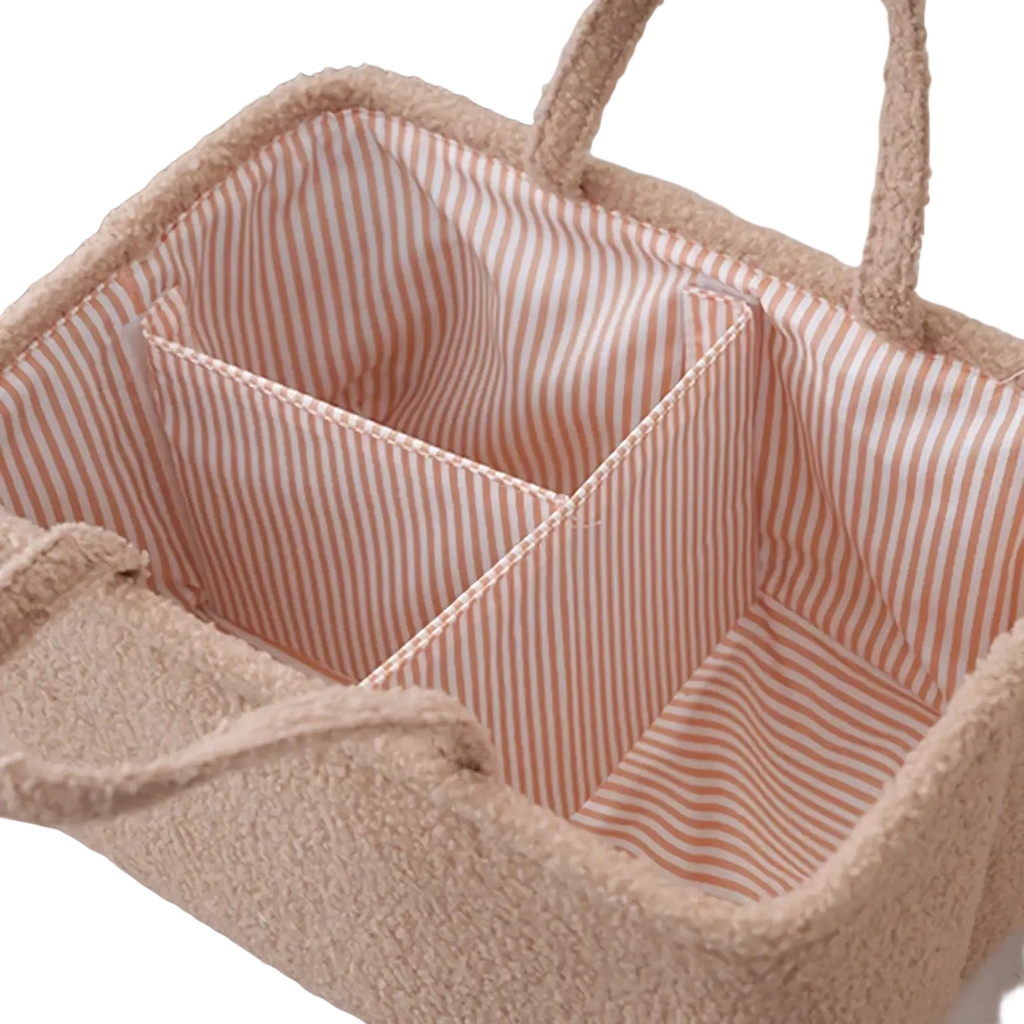 Beige plush fabric baby diaper organizer storage basket with striped interior compartments for easy organization