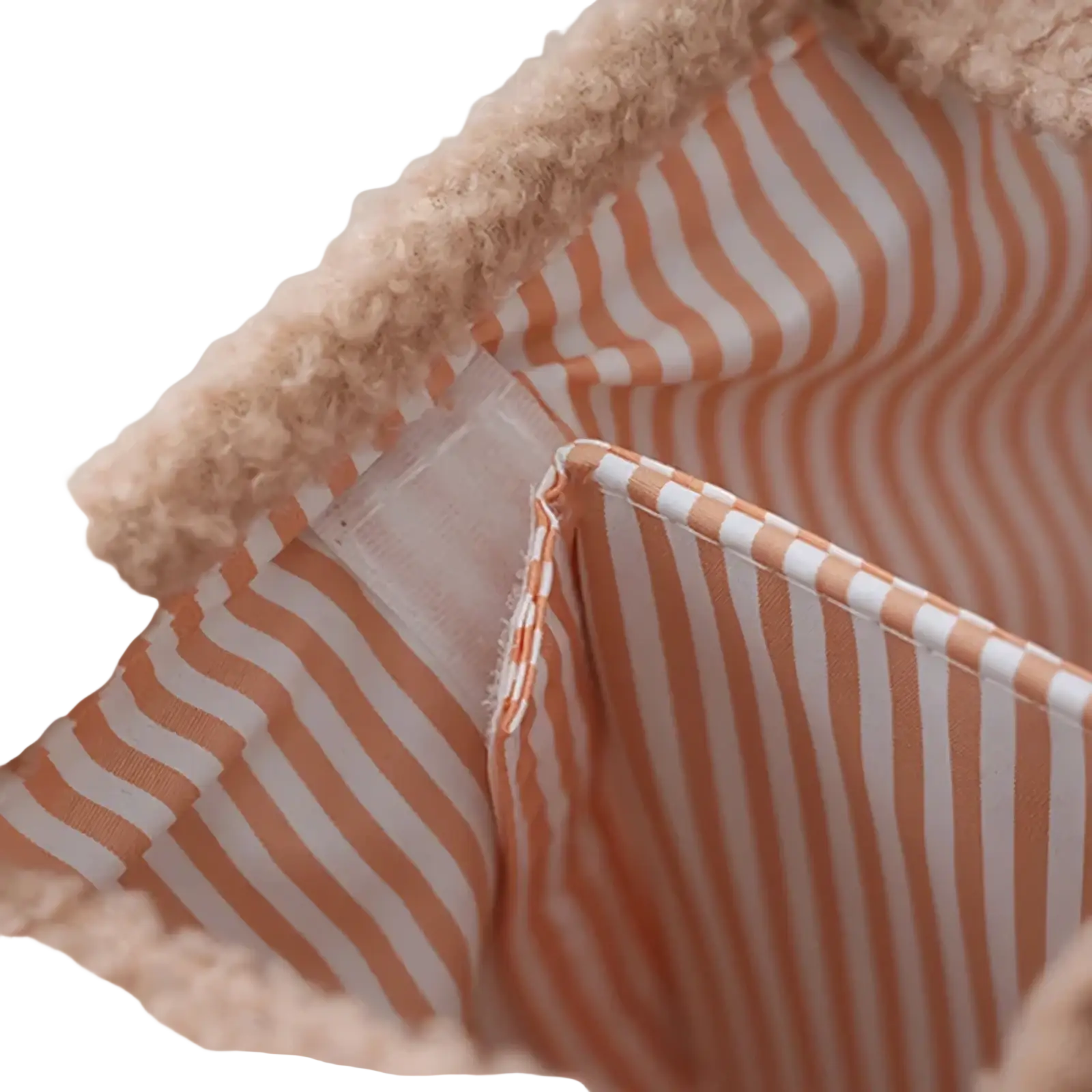 A cozy peach and white striped baby diaper organizer storage basket lined with soft beige fleece trim