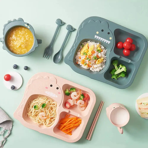 Gray silicone dinosaur-shaped toddler feeding set with three compartments and a smiling face design