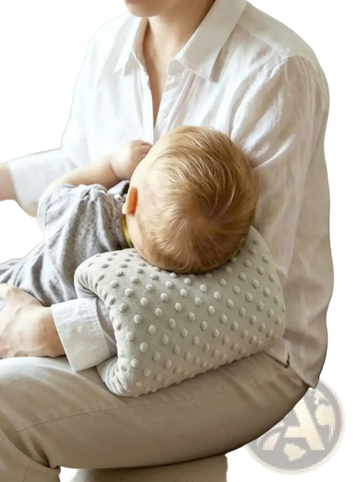 A soft light gray textured baby feeding arm pillow with a dotted pattern for nursing support cushion