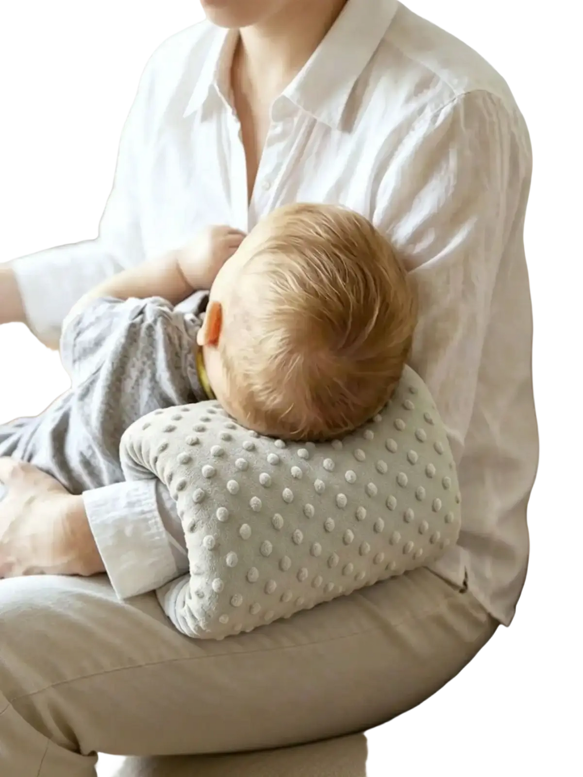 A soft light gray textured baby feeding arm pillow with a dotted pattern for nursing support cushion