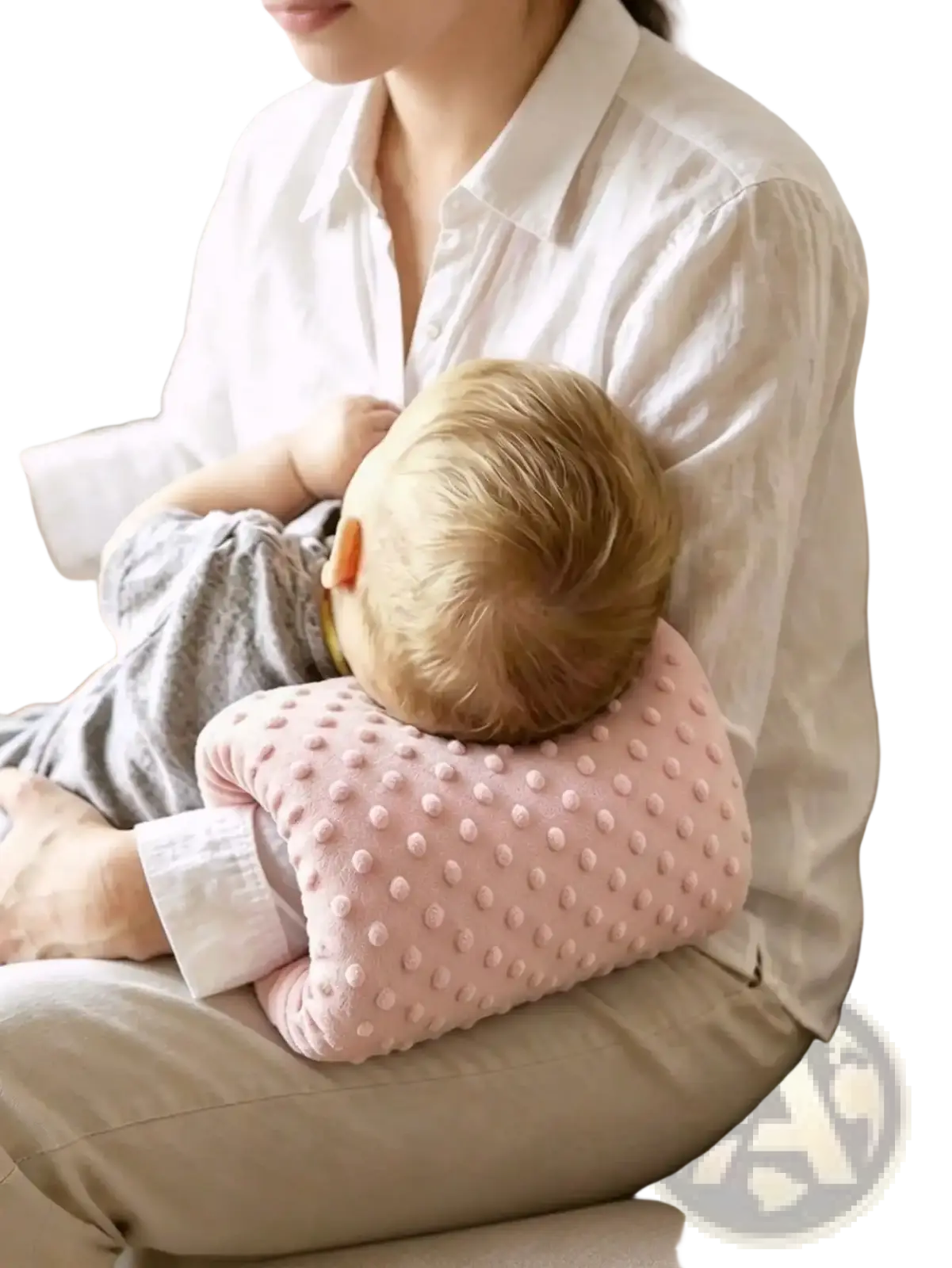 Pink textured baby feeding arm pillow with soft raised dot pattern for nursing support cushion