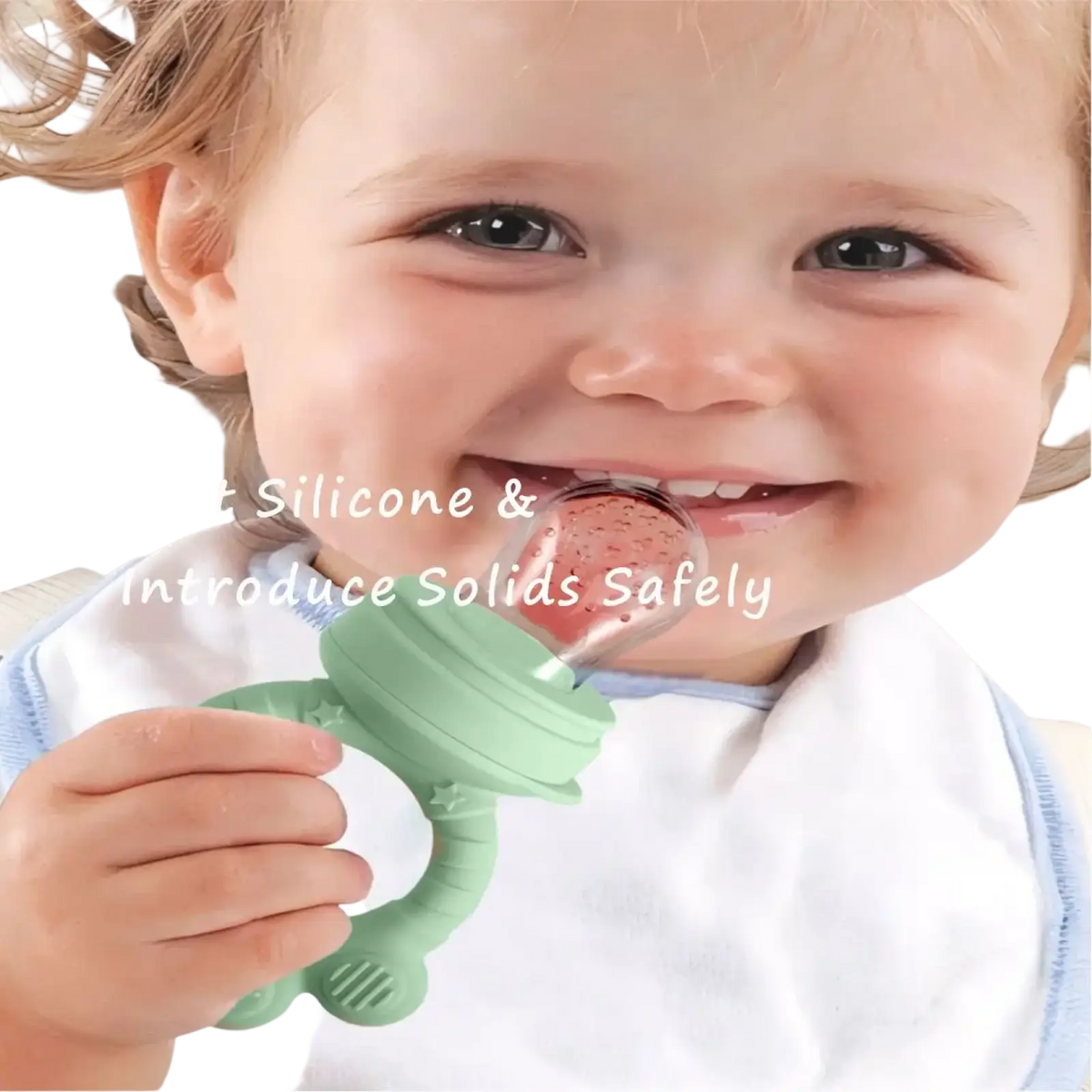 Green silicone baby fruit feeder with strawberry-shaped solid inside from freezer tray set for teething relief