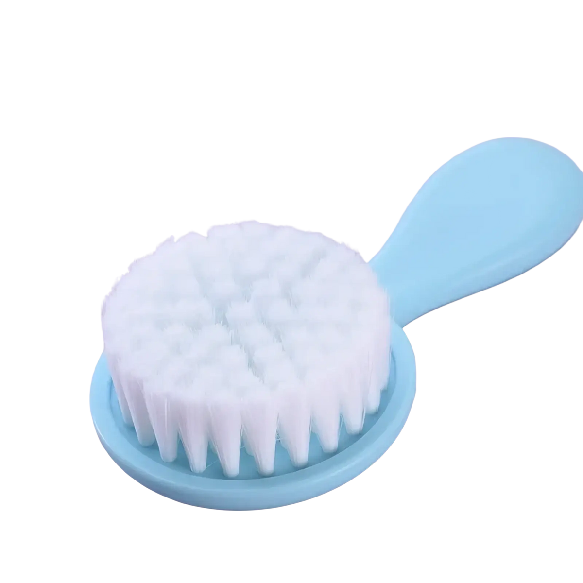 Light blue plastic facial brush with dense white bristles in a baby grooming kit and healthcare set