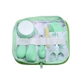 Baby grooming kit and healthcare set in mint green with soft silicone handles and floral-patterned interior lining