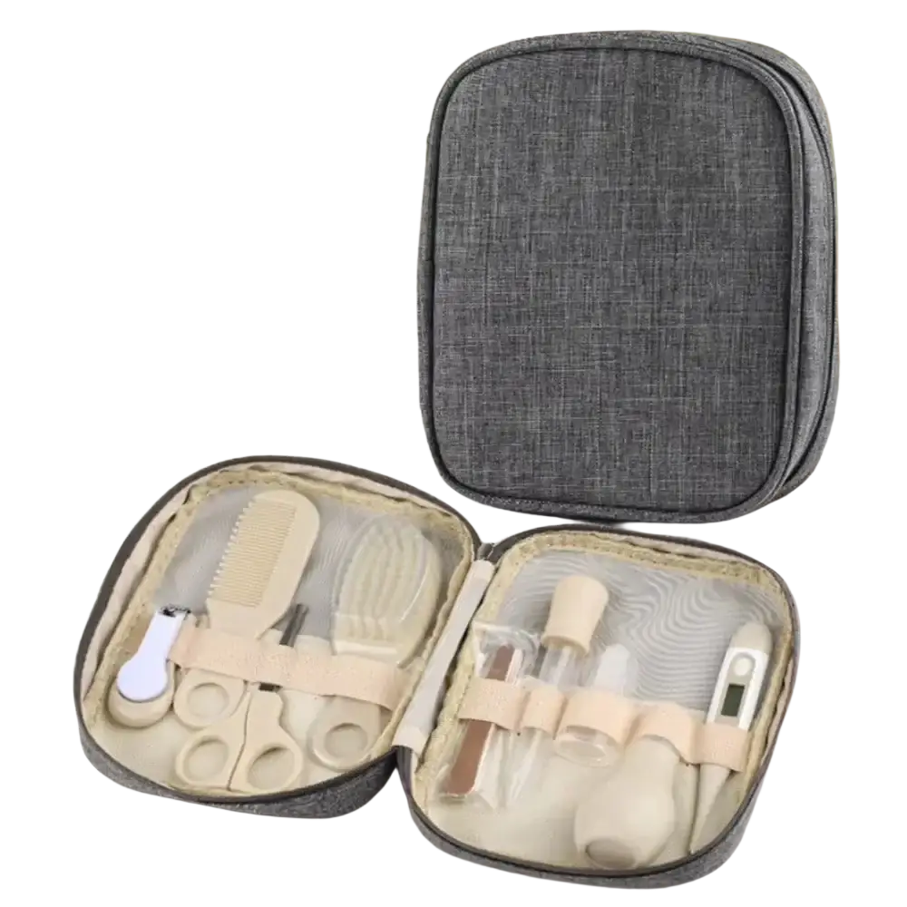 Gray textured fabric travel case containing a beige and white baby grooming kit newborn care set with tools
