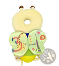 A soft plush snail-shaped baby head protection pillow with pale yellow body and breathable green sides with cartoon animals