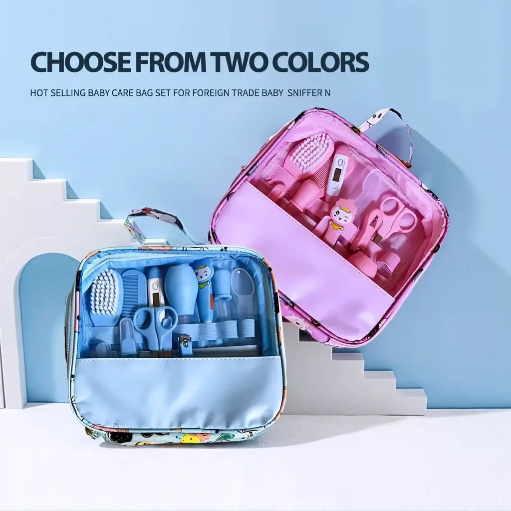 Pink and blue baby healthcare grooming kit set with clear front pockets containing 12 infant grooming tools