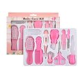 Baby healthcare and grooming kit in pink with soft-bristled brushes comb thermometer nail clipper and scissors