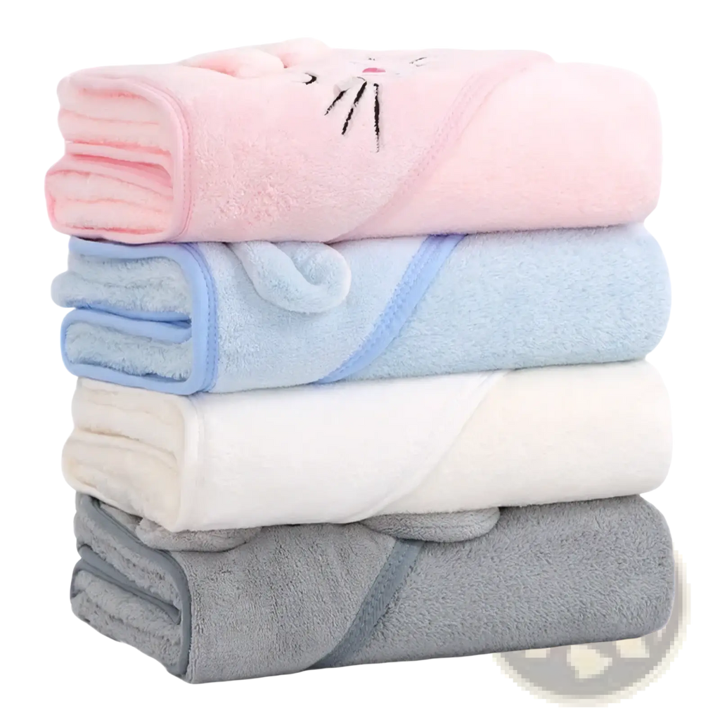 Stacked baby hooded animal bath towels in soft coral fleece with pastel pink blue white and gray plush cat face designs