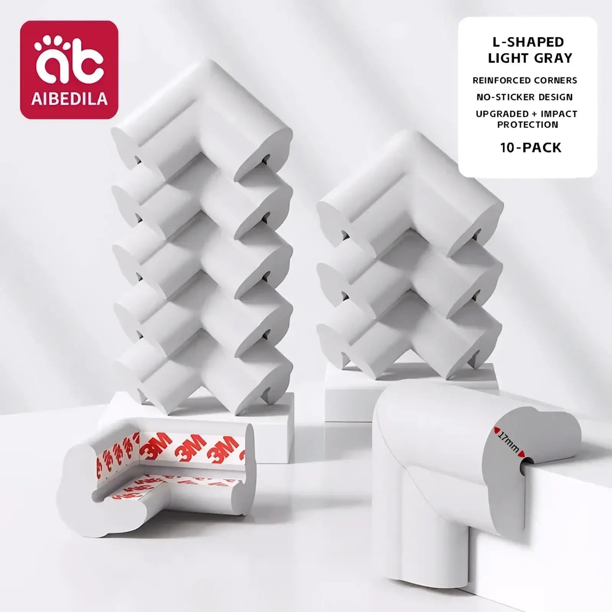 Light gray l-shaped baby safety corner guards made of soft foam with reinforced design and 3m adhesive backing