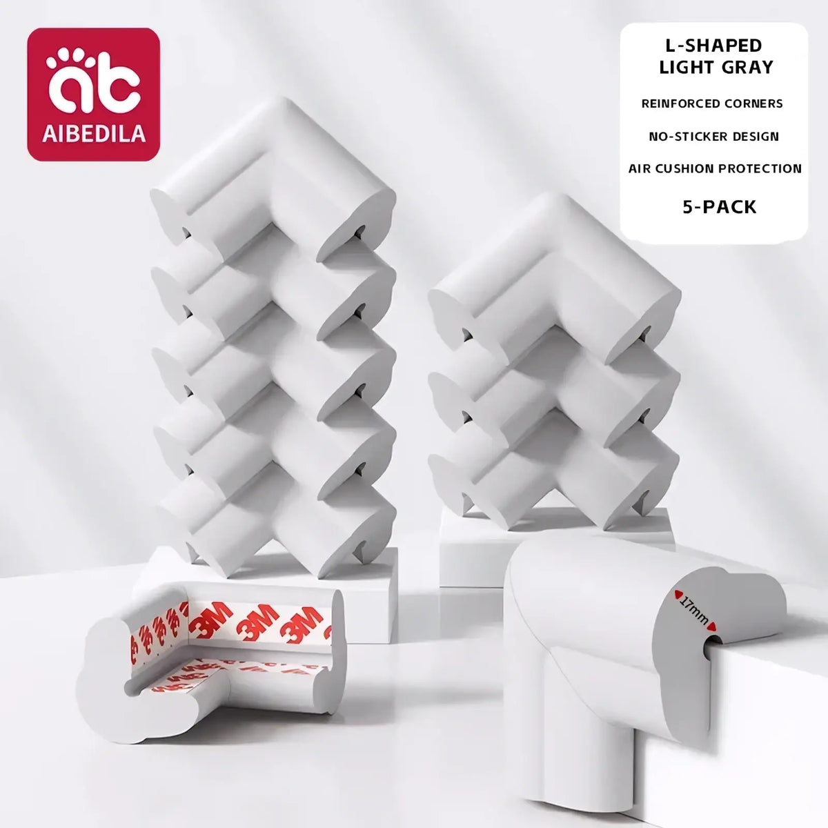 White l-shaped baby safety corner guards made of soft foam with ribbed texture and 3m adhesive backing