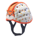 White toddler safety helmet with orange trim, cartoon tiger face, colorful animal prints, and ventilation holes for breathability