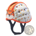 White toddler safety helmet with orange trim, cartoon tiger face, colorful animal prints, and ventilation holes for breathability