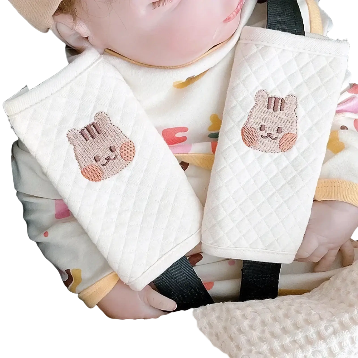 Cream-colored quilted fabric baby seat belt cover with embroidered cute cat faces shoulder pad for car safety
