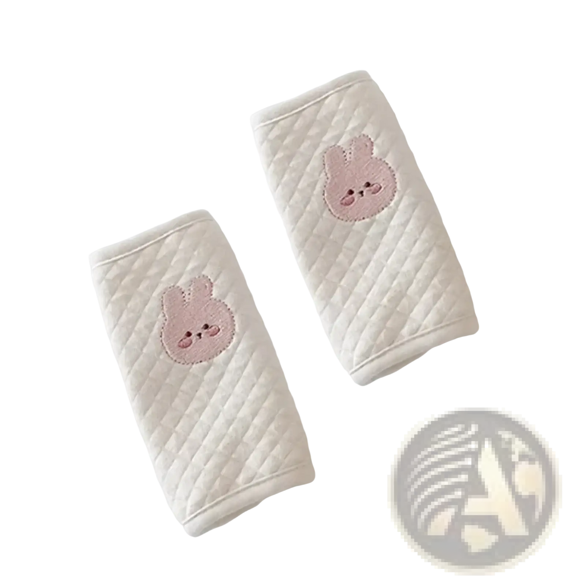 Cream-colored quilted baby seat belt cover with embroidered pink bunny faces for shoulder pad protection