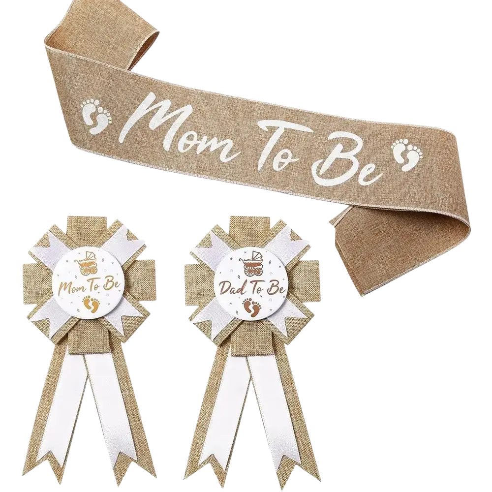 Baby shower burlap mom to be and dad to be sash with white script lettering and matching ribbon rosettes on textured fabric