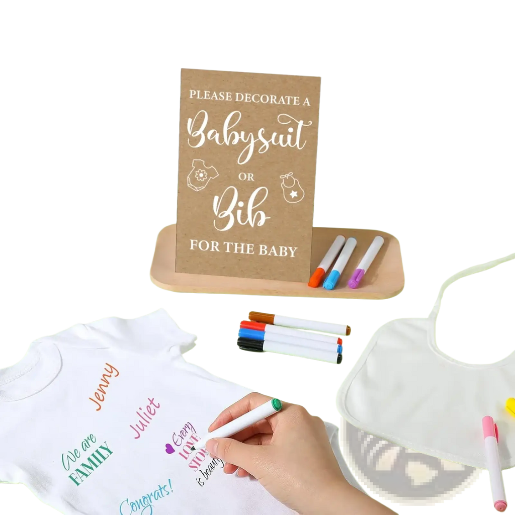 White cotton baby shower DIY bodysuit and bib decorating kit with colorful handwritten messages on the onesie