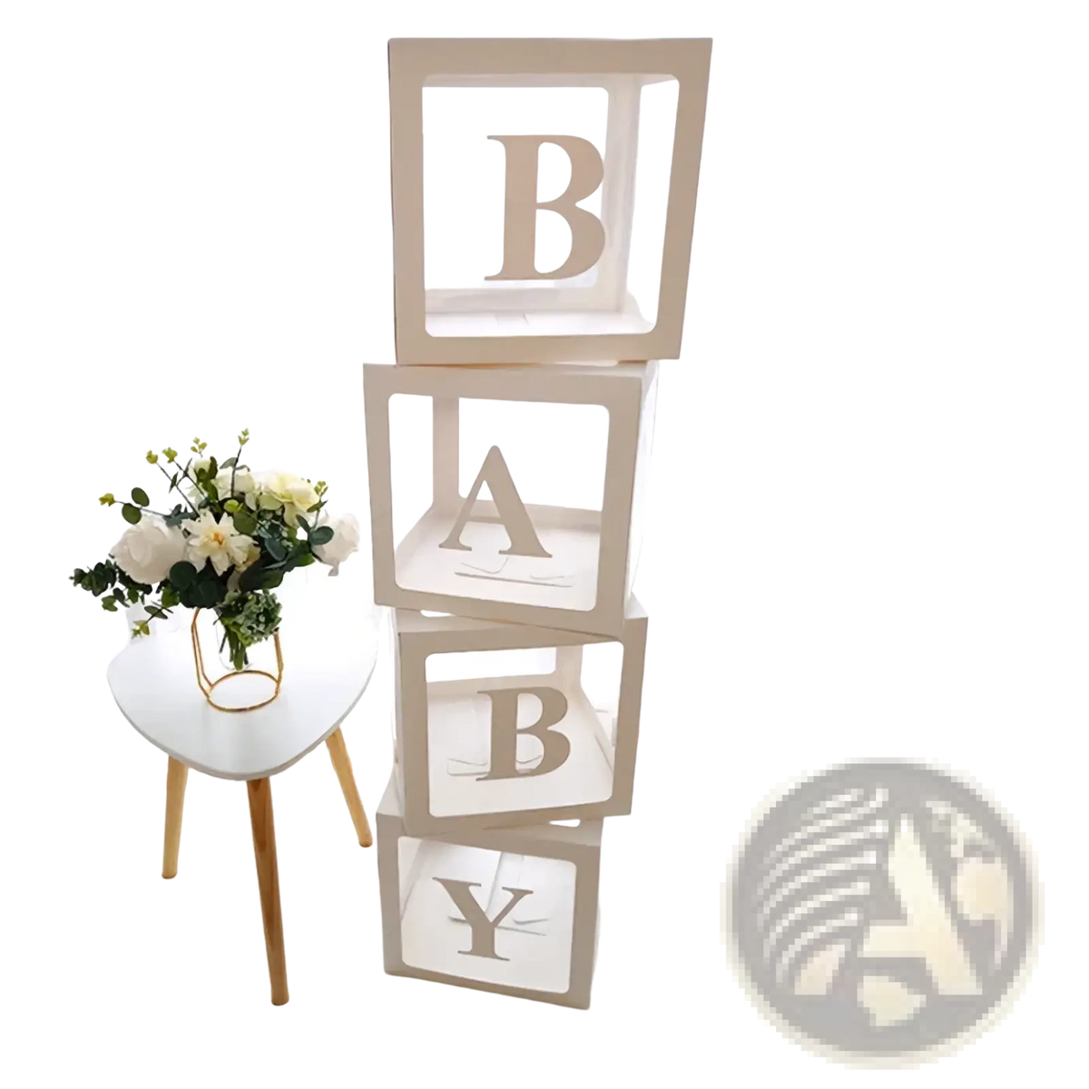 Stacked white baby block letters with gold foil lettering in a baby shower transparent balloon box set