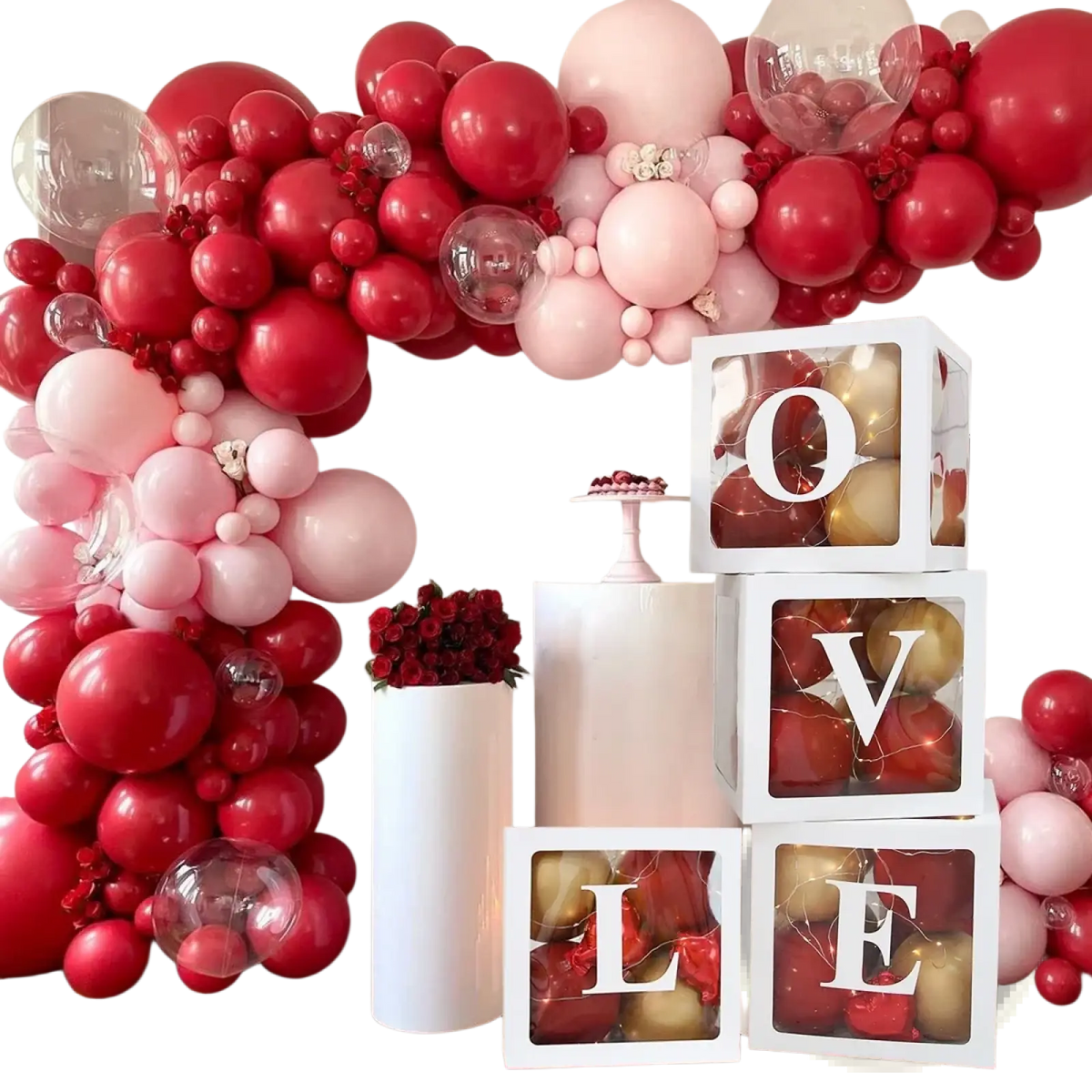A white cube-shaped baby shower balloon box set with a clear front panel displaying love in bold black letters