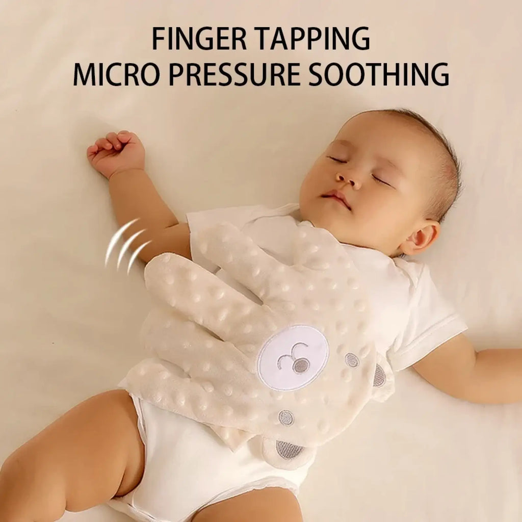 White textured baby finger tapping glove with soft pom-pom dots and embroidered bear face for sleep aid