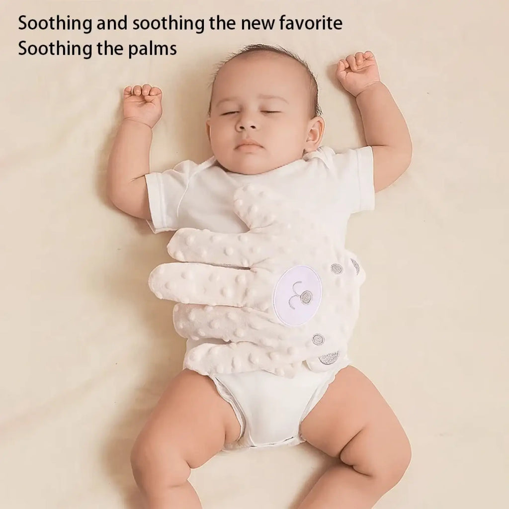White textured baby soothe glove with soft padded fingers and circular button detail for baby sleep aid soothing palm pillow