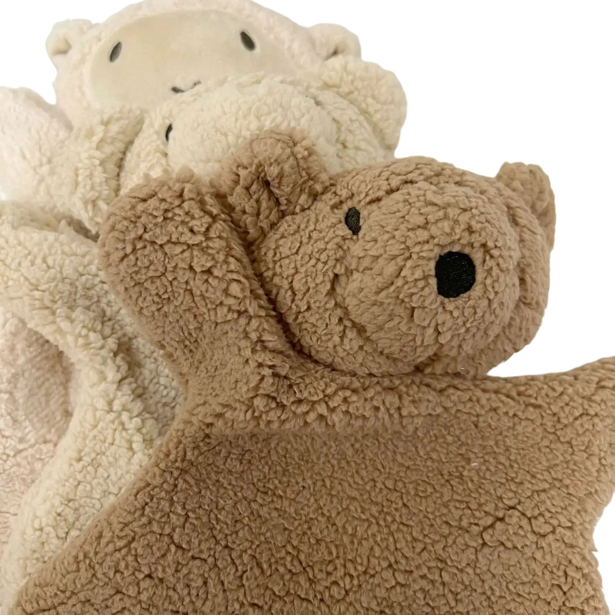 A cozy tan baby soothing plush bear doll with soft textured fleece body and black embroidered eyes photography prop