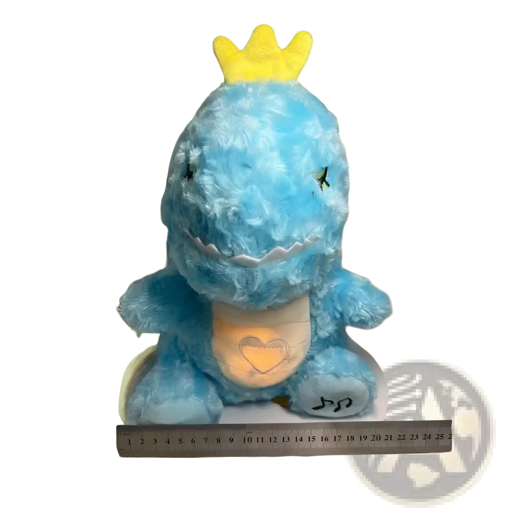 Blue plush dinosaur baby soothing sleep toy with yellow crown and glowing heart on belly for calming comfort