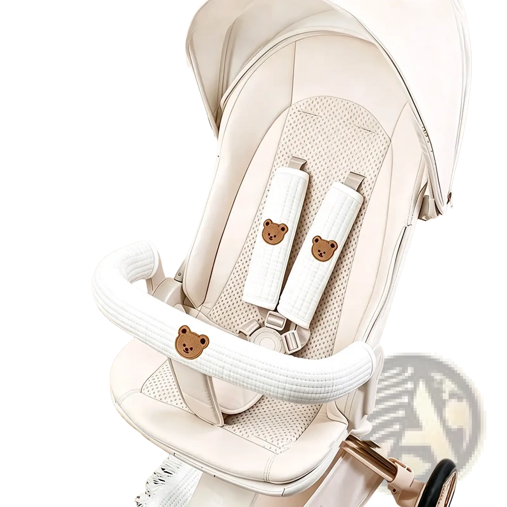 Cream-colored quilted baby stroller seat cover with embroidered bear faces from baby stroller accessory set