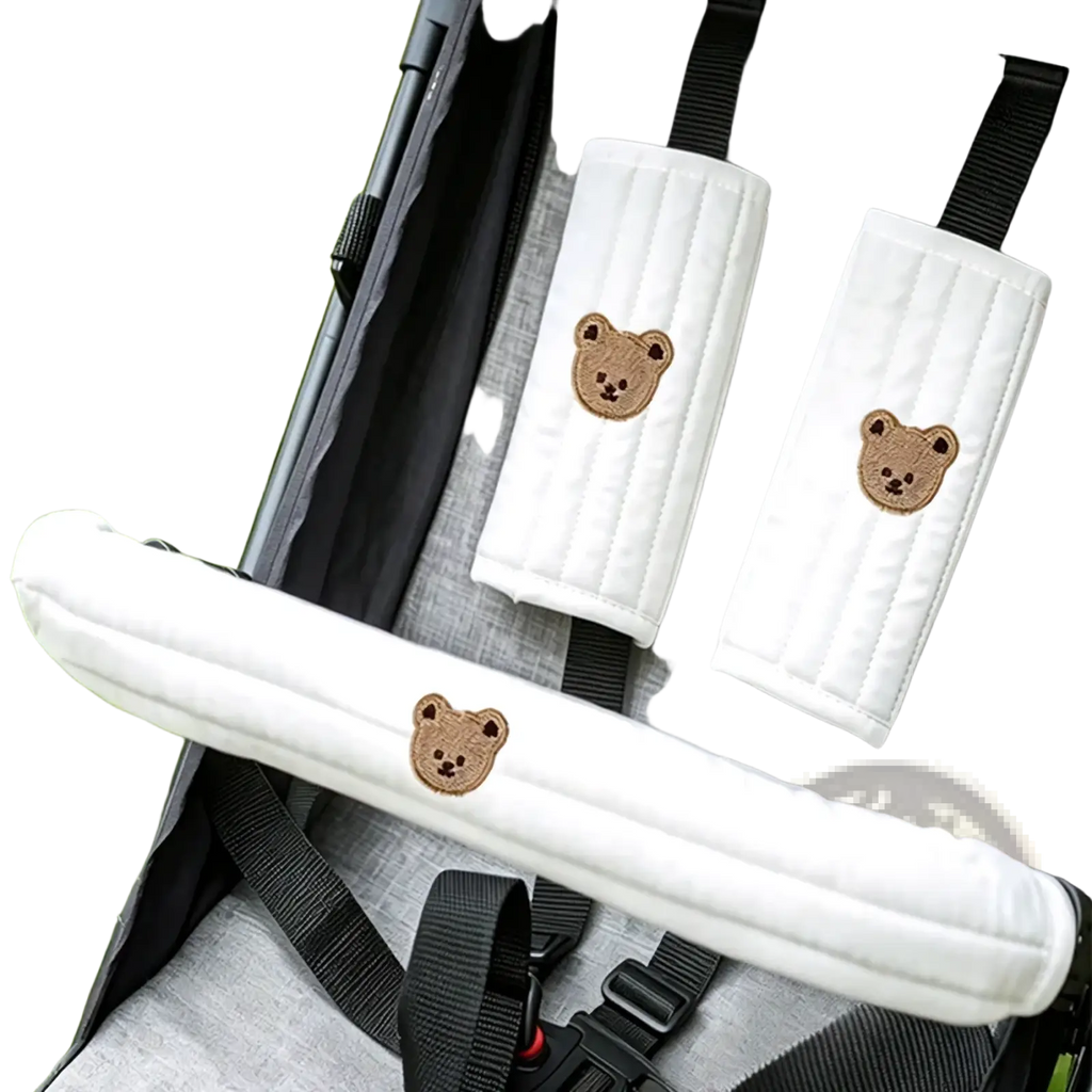 White quilted baby stroller safety straps with embroidered brown bear faces from accessory set cover
