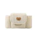 Cream-colored quilted baby stroller organizer bag with soft brown embroidered teddy bear patch on front flap